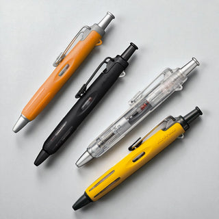 Four Tombow AirPress pens in different colors on a light gray background - Shibuya Stationery