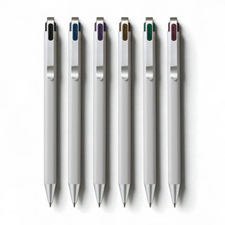 Set of six Sakura Craypas brand Ballsign iD 0.4 mm tip Ball point pens laying flat in a row on a white background - Shibuya Stationery