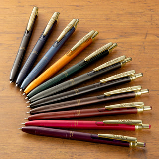 SARASA Grand 0.5mm gel pen color lineup on wood desk – Shibuya Stationery