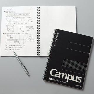 Campus Twin Ring Notebook Square Cut-off Ruled 5mm Black used on desk, example – Shibuya Stationery