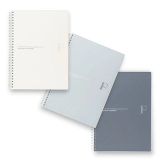 Three spiral-bound Nippon Note brand F.O.B COOP B5 notebooks in white, light gray, and black on a white background - Shibuya Stationery Store
