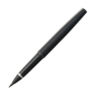 Black colored Kuretake fountain brush pen laying diagonally with no cap on a white background - Shibuya Stationery Store