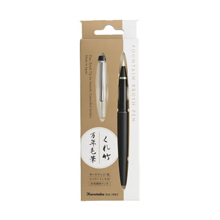 Black Kuretake fountain brush pen inside beige and white packaging on a white background - Shibuya Stationery Store
