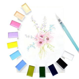 Set of colorful watercolors  from Kuretake with a brush and floral painting arrangement on a white background - Shibuya Stationery Store