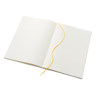 Midori MD Notebook A5 Plain notebook open with yellow bookmark ribbon – Shibuya Stationery