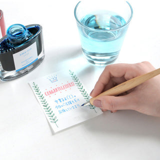 Pilot Iro-Utsushi Dip Pen Fine writing with blue ink beside rinse water – Shibuya Stationery