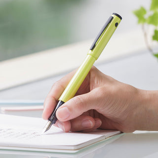 Pilot Lightive Fountain Pen Fine Active Yellow writing on paper – Shibuya Stationery