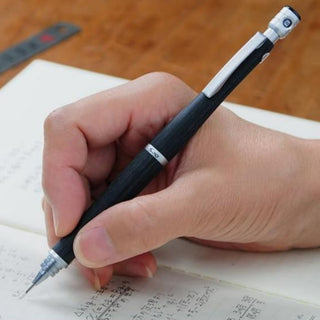 Hand writing in a notebook with a Pilot S20 mechanical pencil - Shibuya Stationery Store
