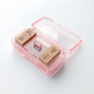 Kiki’s Delivery Service stamp cases opened with stamps displayed – Shibuya Stationery