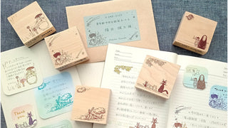 Set of wooden stamps with illustrations on a paper background