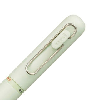 Detailed view of the rear barrel color selectors on the Uni-ball One 3 in Grass Green.