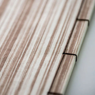 Wacho Kakishibu Persimmon Dyed Notebook Stripe style binding close-up - Shibuya Stationery