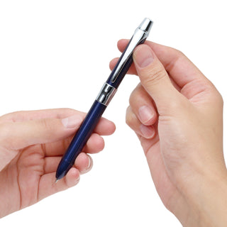 Two hands holding a Zebra brand filare 2+S blue multi pen on a white background - Shibuya Stationery Store