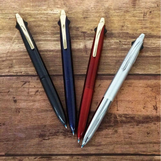 Zebra Filare 3C Multi Pen 0.7 four-color lineup on wooden desk – Shibuya Stationery