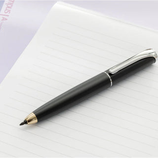 Black Zebra filare direction pen with 6mm tip laying diagonally on a piece of lined notebook paper - Shibuya Stationery Store