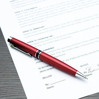 Filare Twist Ballpoint Pen 0.7 Red placing on a paper – Shibuya Stationery